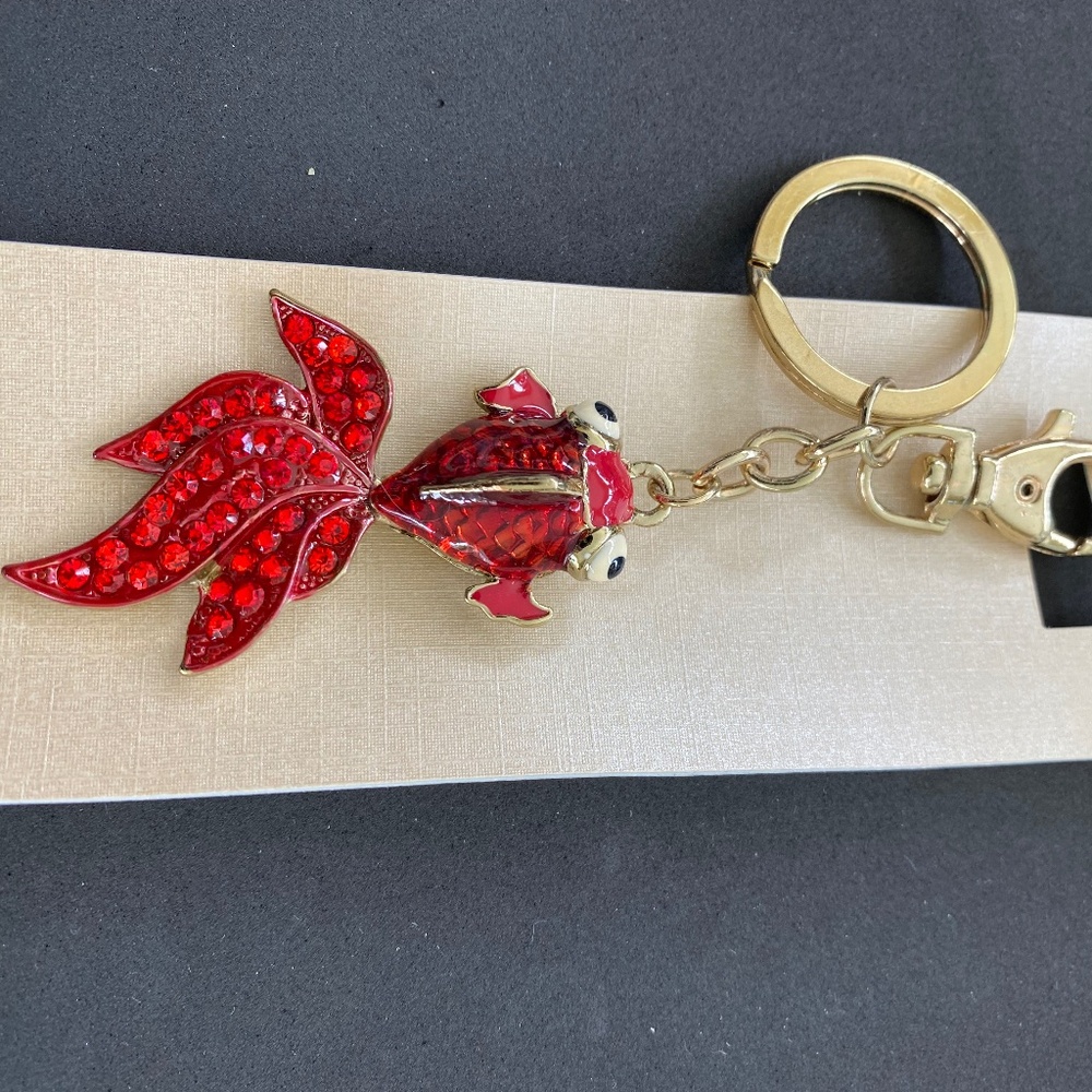 Chinese style fish key chain.  Enameled with red crystal tail that moves